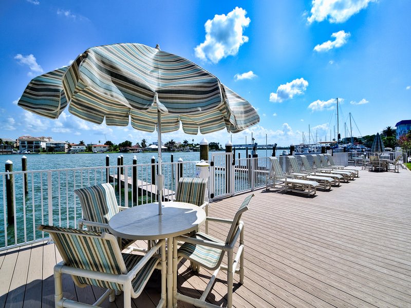 Table, chairs and umbrellas for guests.
